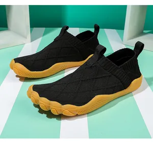 Detail view of lightweight barefoot walking shoes with breathable black knit upper