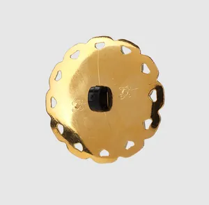 Detailed back view of a gold scalloped edge button with black shank and heart cutouts
