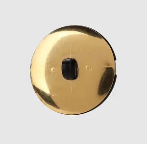 Detail view of the back shank of a premium gold-toned round nylon button for clothing