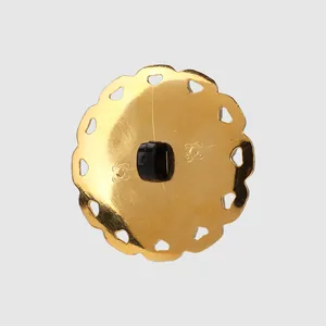 Elegant golden scalloped edge button with heart cutouts and durable black shank back