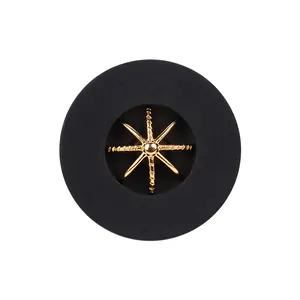High-end matte black nylon button featuring a decorative gold eight-pointed star design.