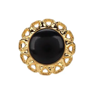 Elegant gold floral heart frame button with smooth black center for high-end garments