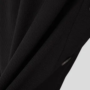 Close-up detail of black ribbed knit fabric and button on men's long sleeve T-shirt.
