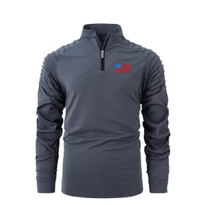 Gray men's quarter-zip sports shirt with pleated sleeves and US flag patch
