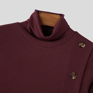 Detail view of burgundy ribbed turtleneck with decorative shoulder buttons for men