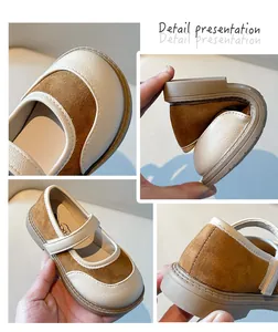 Viste dettagliate di scarpe Mary Jane marroni da bambina con suola morbida e trama in pelle