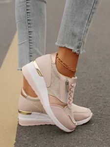 Fashionable pink platform sneakers for women with side zipper and metallic gold accents