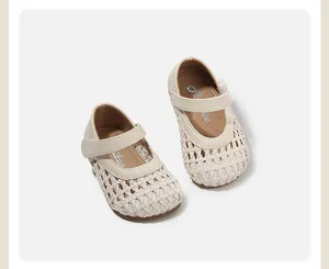 High-quality top view of cream woven leather baby princess shoes with velcro strap detail