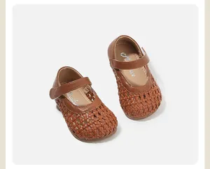 Detailed view of brown woven hollow baby Mary Jane shoes for summer breathability
