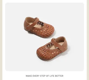 Detailed view of brown woven toddler Mary Janes with hollow-out pattern