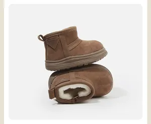 Detailed view of brown toddler snow boots with warm faux fur lining and soft sole