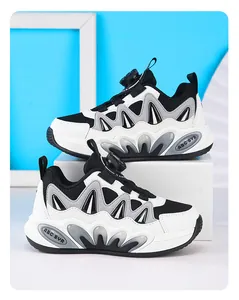 Detail view of breathable mesh children's sports shoes with rotary buckle for boys