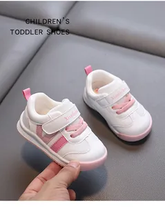 Detailed view of pink and white toddler sneakers featuring breathable mesh and velcro strap