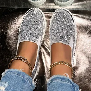 Sparkly silver sequin slip-on platform shoes for a glamorous casual look outdoors