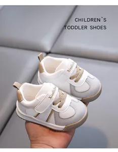 Close-up view of white toddler walking shoes with breathable mesh and velcro strap