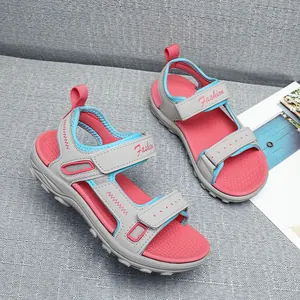 Detailed view of girls' fashion beach sandals with adjustable straps and pink accents