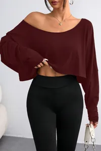 Detailed shot of a stylish maroon off-the-shoulder cropped long sleeve top for women