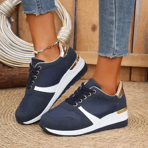 Stylish women's navy blue casual lace-up wedge sneakers featuring gold metallic heel accents.