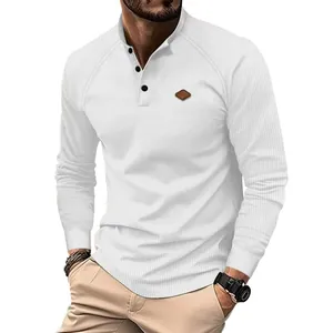 Detail of white waffle knit Henley shirt with three buttons and chest patch.