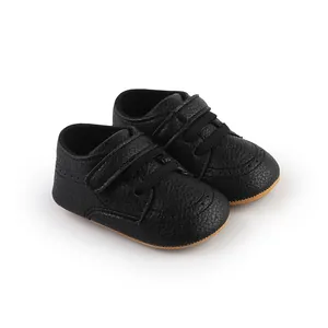 Black PU leather baby pre-walker shoes with hook-and-loop closure and soft soles.