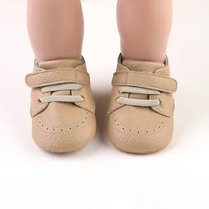 Khaki leather baby walking shoes with velcro strap and brogue detail for infants