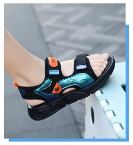 Detail shot of black boys' beach sandals with iridescent blue and orange accents