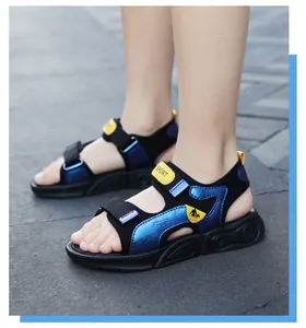 Close-up of boys' blue and black summer sandals with soft non-slip soles on a child's feet