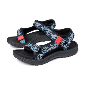 Detailed view of children's camouflage beach sandals with adjustable red velcro straps