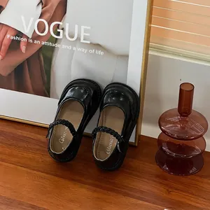 Stylish black patent leather girls Mary Jane shoes with elegant braided strap