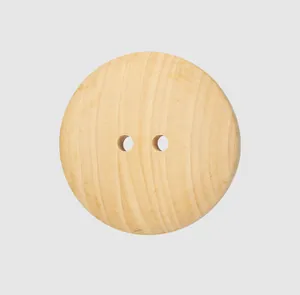 Detailed view of a two-hole natural poplar wood button showing smooth texture