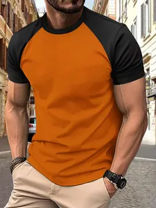 Detailed view of men's slim-fit athletic raglan T-shirt in vibrant orange and black colors