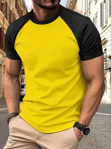 Detailed view of men's yellow and black raglan sleeve sports T-shirt on a model.