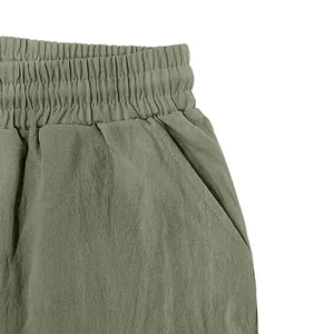 Close-up of elastic waistband and side pocket on men's breathable linen-textured pants