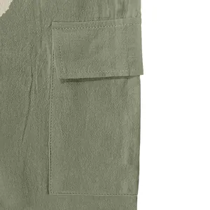 Macro view of cargo pocket on men's linen pants showing fabric texture
