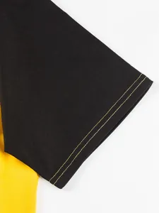 Detailed view of men's raglan t-shirt sleeve featuring double yellow contrast stitching.