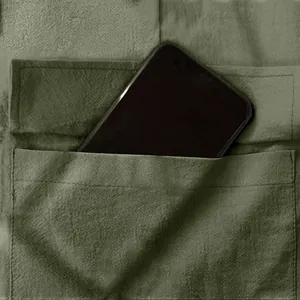 Detailed view of large pocket on men's breathable green linen cargo pants