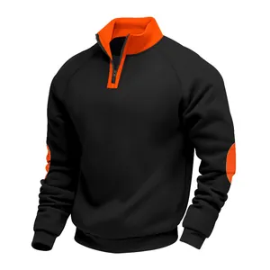 Close-up of black and orange sweatshirt showing half-zip stand-up collar design