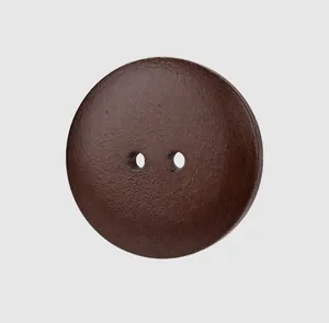Close-up of a natural dark brown wooden button with a smooth circular two-hole design.