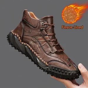 Detailed view of brown leather outdoor travel boots with warm fleece lining