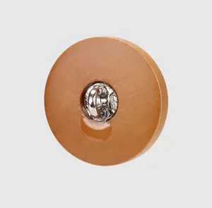 Detail shot of natural poplar wood button featuring a durable metal sewing shank