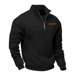 Macro view of black men's half-zip sweatshirt featuring a stand collar and ribbed cuffs
