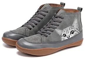 Detailed view of the cute cat face print on gray suede-style flat ankle boots for women