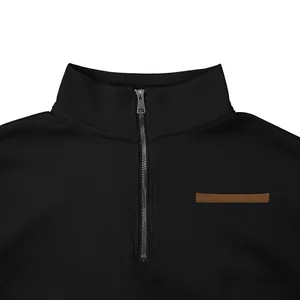 Close-up of black half-zip sweatshirt collar with metal zipper and brown detail.