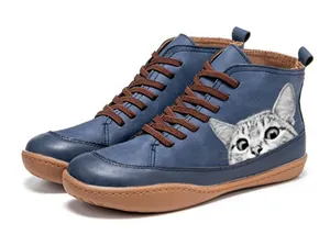 Detail of blue high-top flat boot featuring a cute grey cat print on the side
