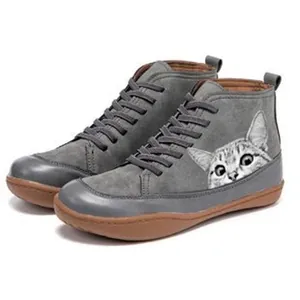 Grey flat ankle boots featuring a cute printed cat face and durable brown rubber sole
