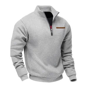 Detailed view of grey quarter-zip fleece sweatshirt with stand collar design