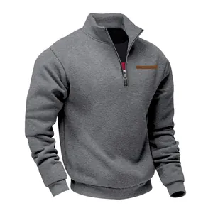 Detail view of men's grey half-zip sweatshirt with stand collar and fleece lining
