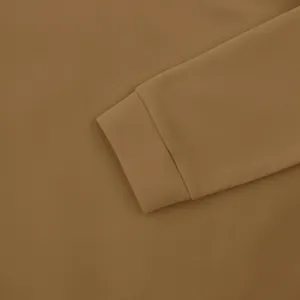 Close-up of ribbed cuff and fleece fabric on men's khaki pullover sweatshirt detail