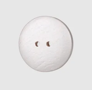 Macro view of natural poplar wood button with elegant white textured finish