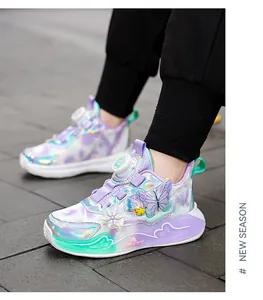 Detailed view of iridescent girls' sneakers with butterfly and snowflake accents